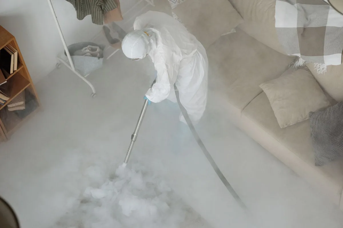 Biohazard cleanup technician in protective equipment, Virginia Highland, Atlanta, GA